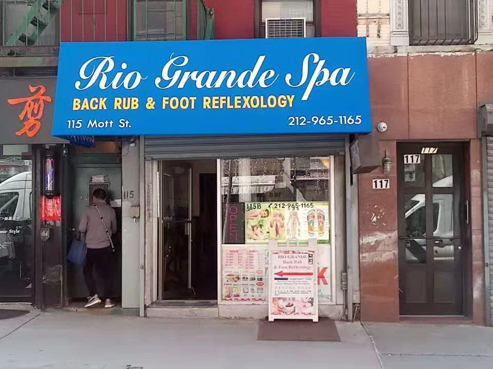 Rio Grande Spa storefront on Mott Street with a blue awning reading Back Rub and Foot Reflexology, 115 Mott St, 212-965-1165